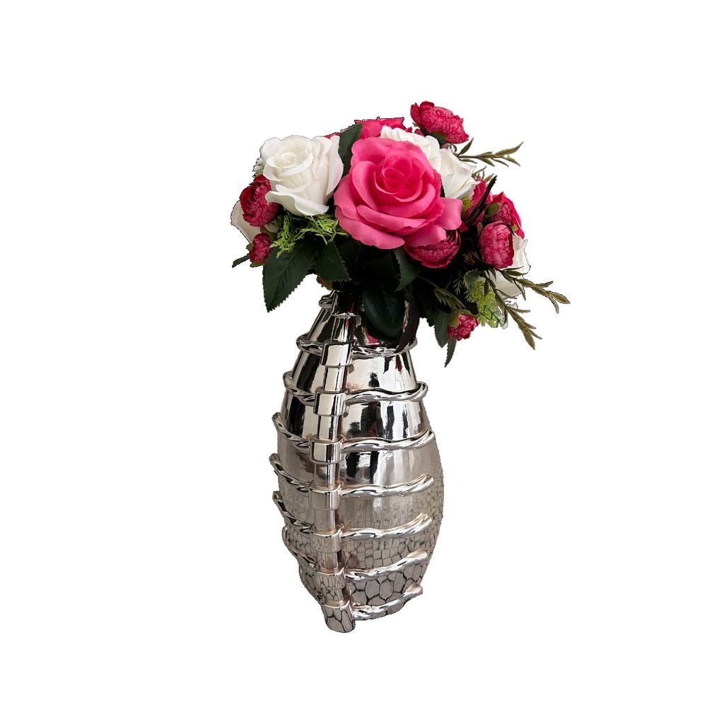 Angled view of CHINE VASE chrome covered SLA printed resin vase with pink and white floral arrangement