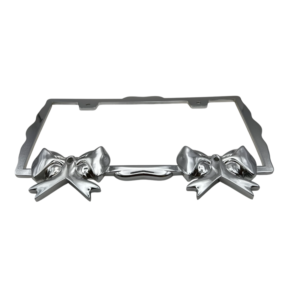 Front view of chrome sculpted bow license plate frame, durable weather-resistant finish