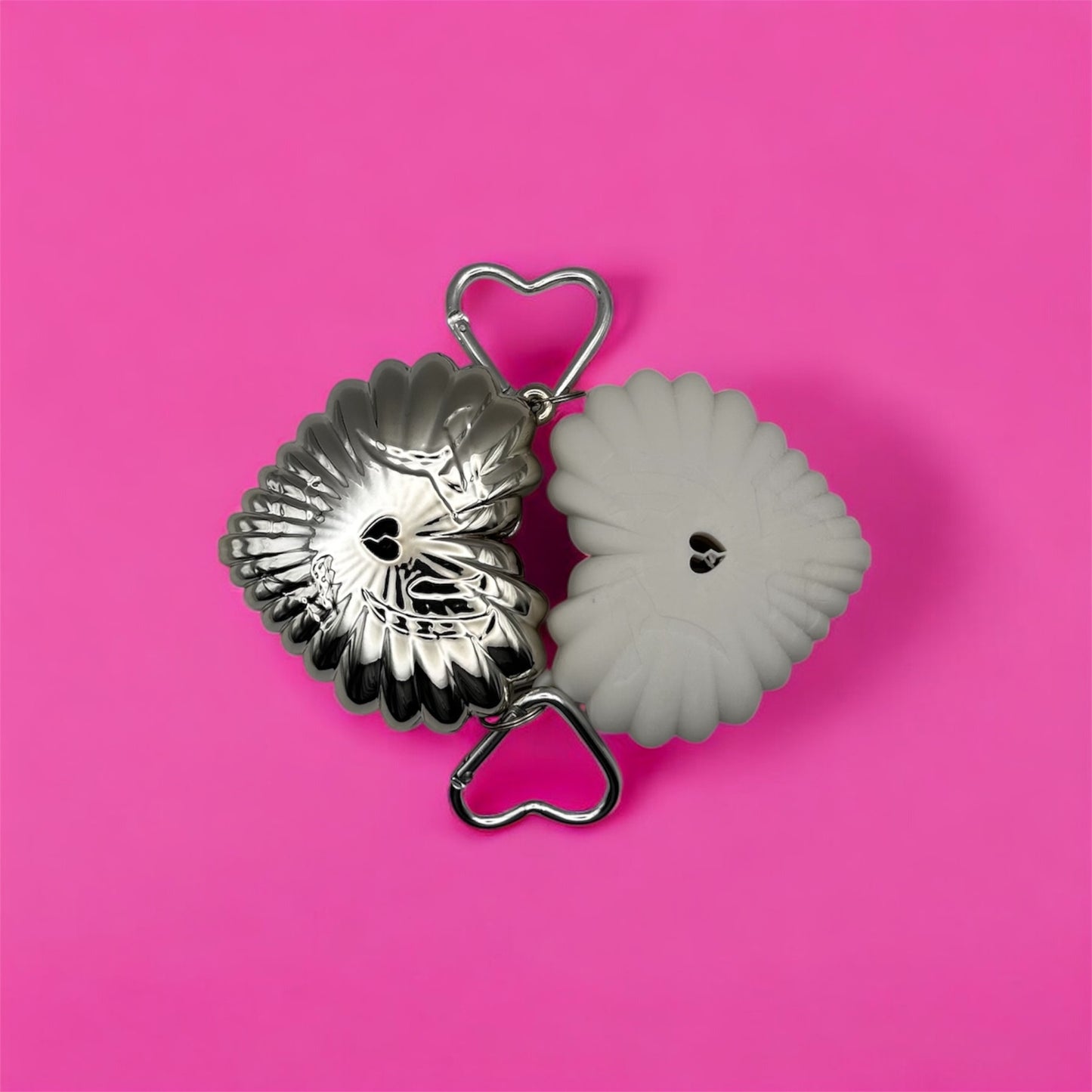 HEART ON FIRE 3D-printed lighter cases shown in chrome-plated and raw resin versions on a pink background.